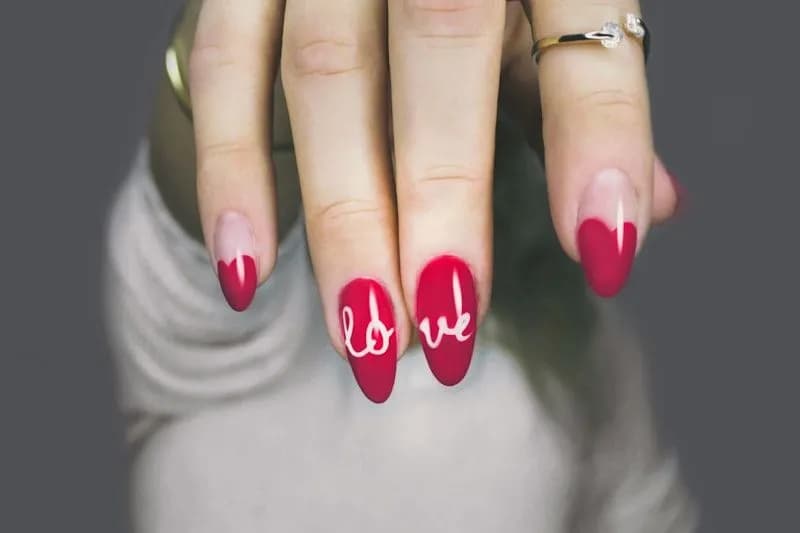 Red ombre nail art with love lettering design